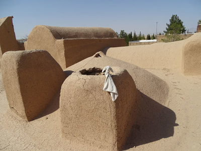 Windcatchers on the rooftop of an ancient mud house in Mazraeh Kalantar near Yazd